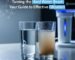 Side-by-side comparison of two glasses of water. The left glass contains clear, purified water, while the right glass shows cloudy, yellowish hard water with visible sediment. A modern water purification system is in the background, with the title 'Taming the Hard Water Beast: Your Guide to Effective Filtration