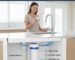 Choosing the best compact in-line water filters for home use, showing the simple installation behind a refrigerator or under a sink, recommended by a pp cotton household water purifier company.
