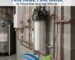 A professional 5 micron whole house water filter system installed in a modern basement. This high-quality sediment filtration solution from a leading PP cotton household water purifier company ensures clean, pure water for every tap in your home. Perfect for removing rust and sand.